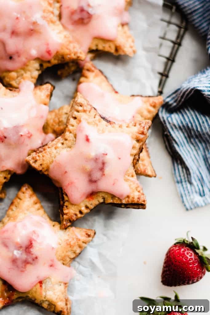 Strawberry Rhubarb Hand Pies Star shaped hand pies with pink glaze