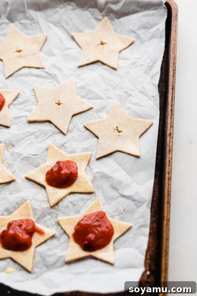 Strawberry Rhubarb Hand Pies Star shaped cut-outs with jam on tray