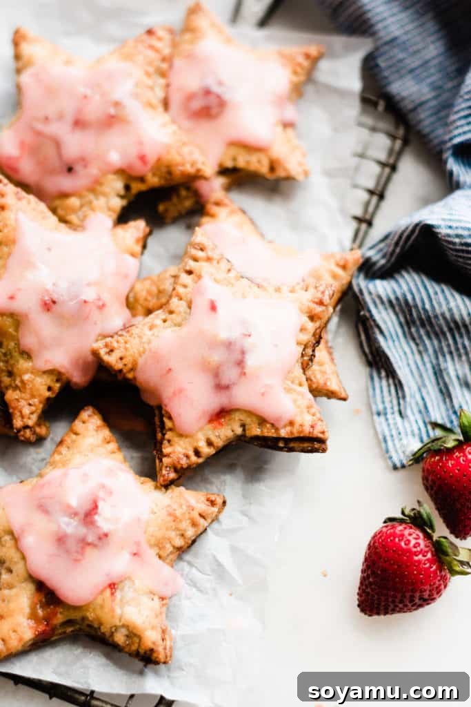 Strawberry Rhubarb Hand Pies Close-up of hand pies with strawberries
