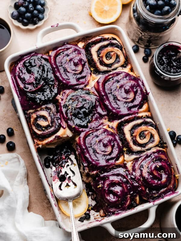 Homemade Blueberry Oat Crumble Bars 16 A pan of blueberry frosted cinnamon rolls.