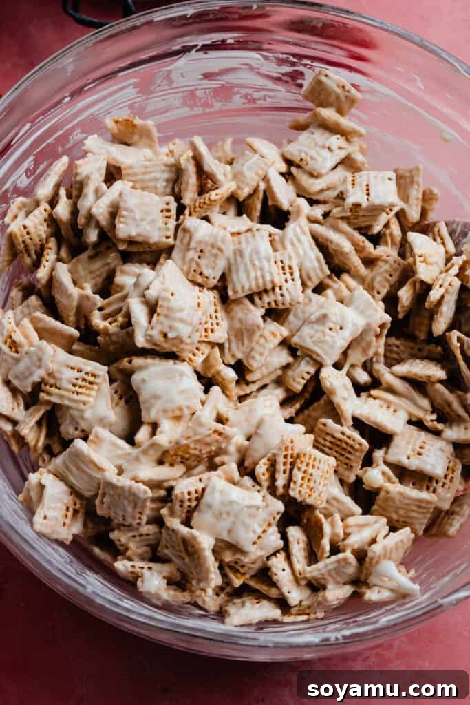 4-Ingredient Strawberries and Cream Puppy Chow Recipe 6 A bowl of the chex cereal coated in white chocolate.