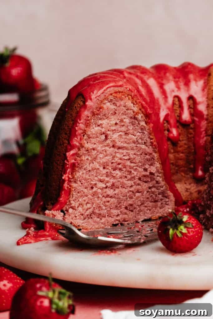 A close-up of the inside of the sliced strawberry bundt cake.