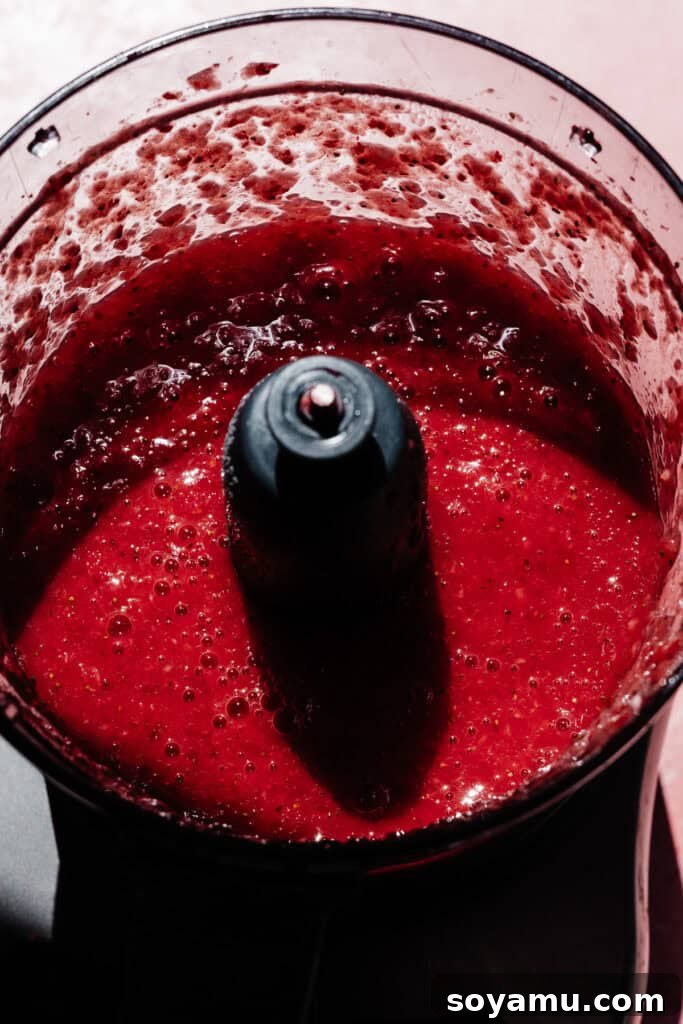 Strawberry liquid in the food processor.