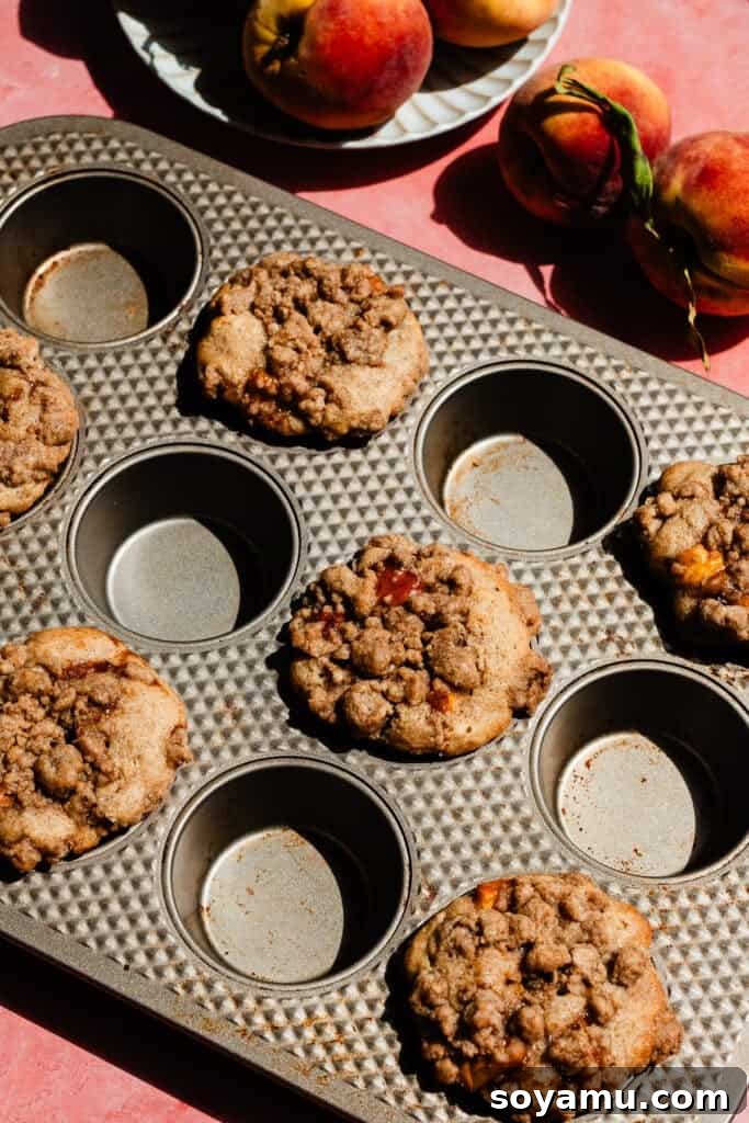 Southern-Style Peach Cobbler Muffins Recipe 13 The baked muffins in the pan.