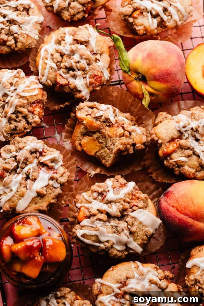 Southern-Style Peach Cobbler Muffins Recipe 14 Peach Cobbler Muffins on a wire rack.