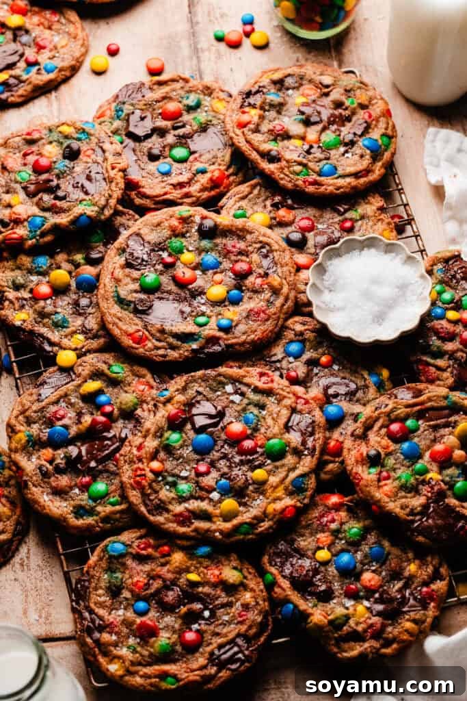 Thin, Chewy M&M Chocolate Chip Cookies 12 Thin & chewy m&m cookies on a cooling rack.