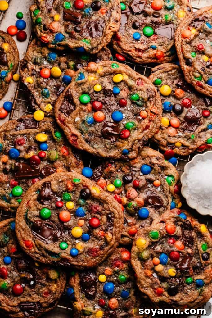 Thin, Chewy M&M Chocolate Chip Cookies 14 A bird's eye view of a cooling rack with layers of the m&M cookies.
