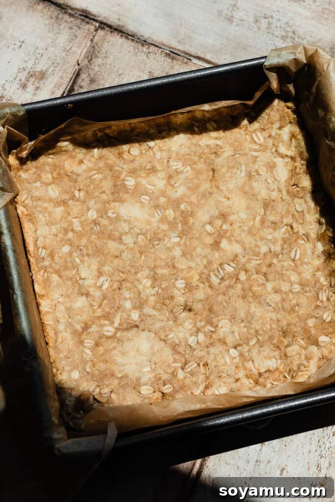 Carmelita Bars with Homemade Salted Caramel Filling 8 A pan of the par-baked bottom crust. It looks matte, and the edges are the tiniest bit raised.
