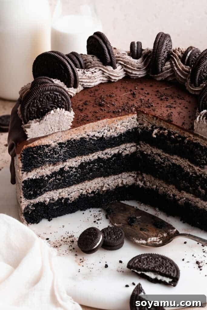 Decadent Moist Oreo Cake Recipe 2 A close-up of the inside of the sliced oreo cake, showing the layers of cake and frosting.