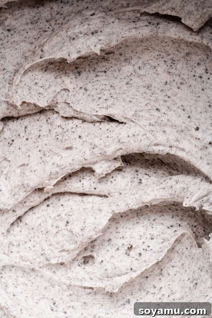 Decadent Moist Oreo Cake Recipe 11 A close-up of the creamy oreo frosting.