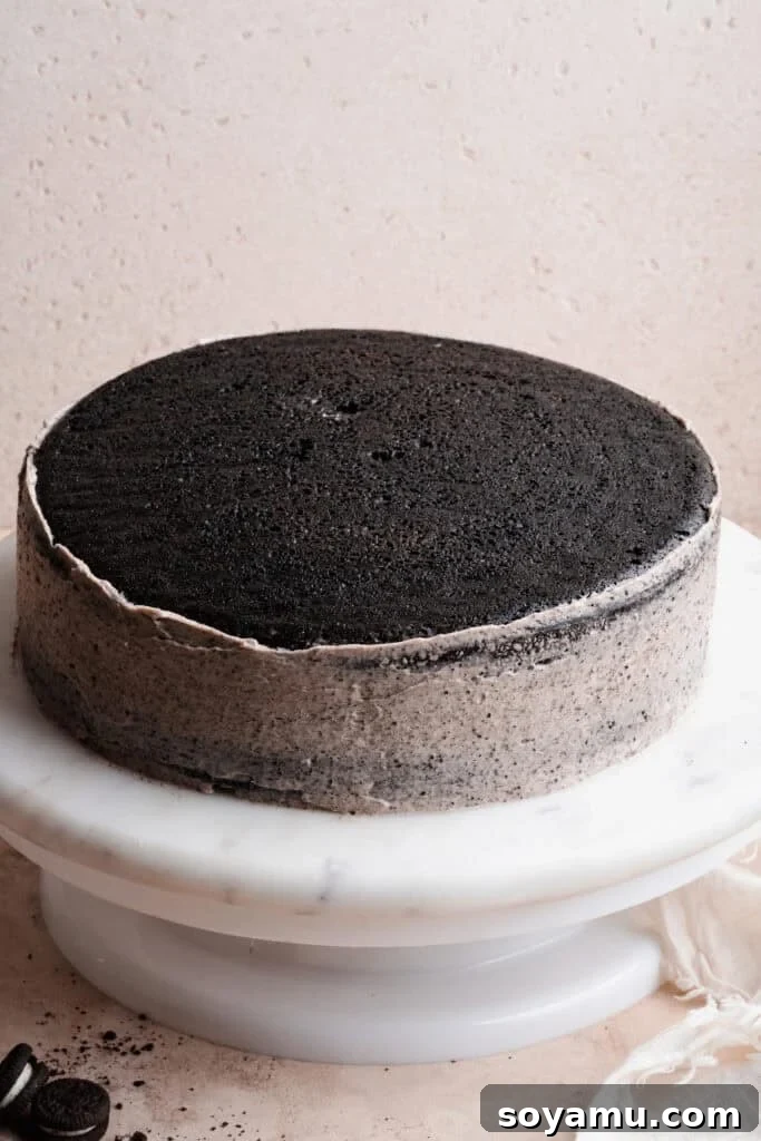 Decadent Moist Oreo Cake Recipe 13 The first two layers of cake stacked and frosted.