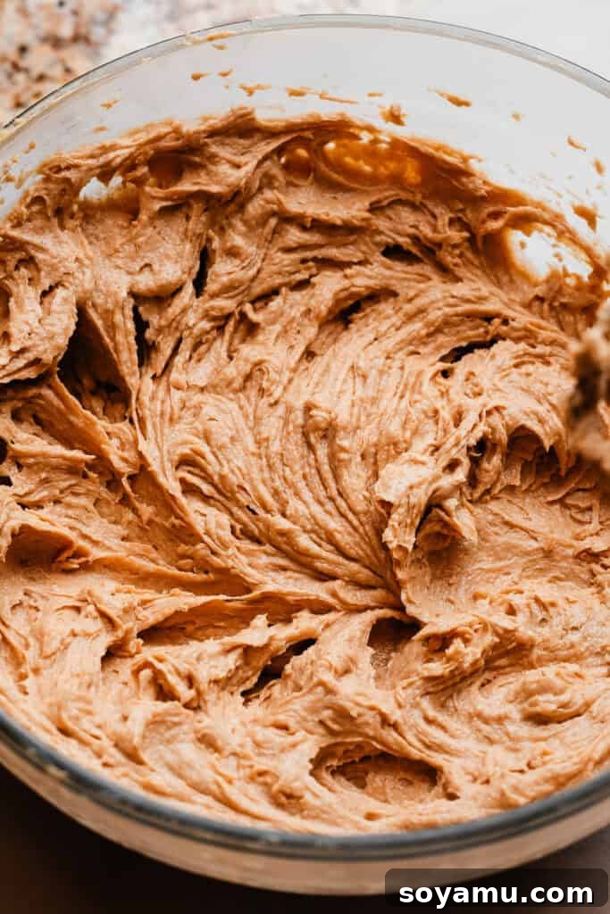 Chewy No-Chill Peanut Butter Chocolate Chip Cookies 5 A bowl of the wet ingredients creamed into a fluffy mixture.
