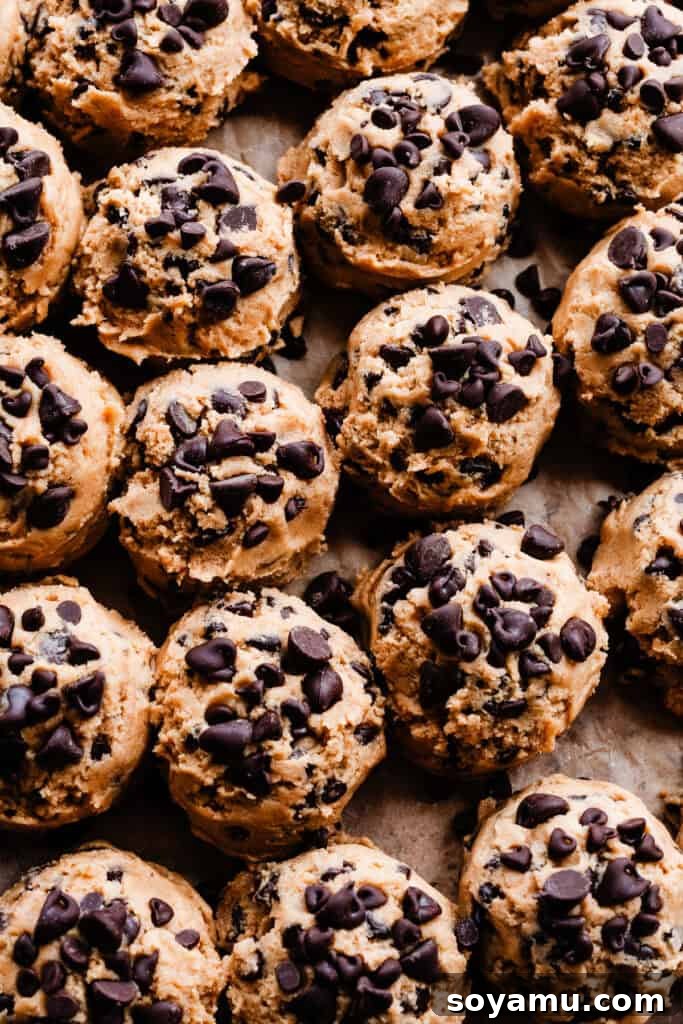 Chewy No-Chill Peanut Butter Chocolate Chip Cookies 7 A close-up of all the cookie dough balls on a pan.